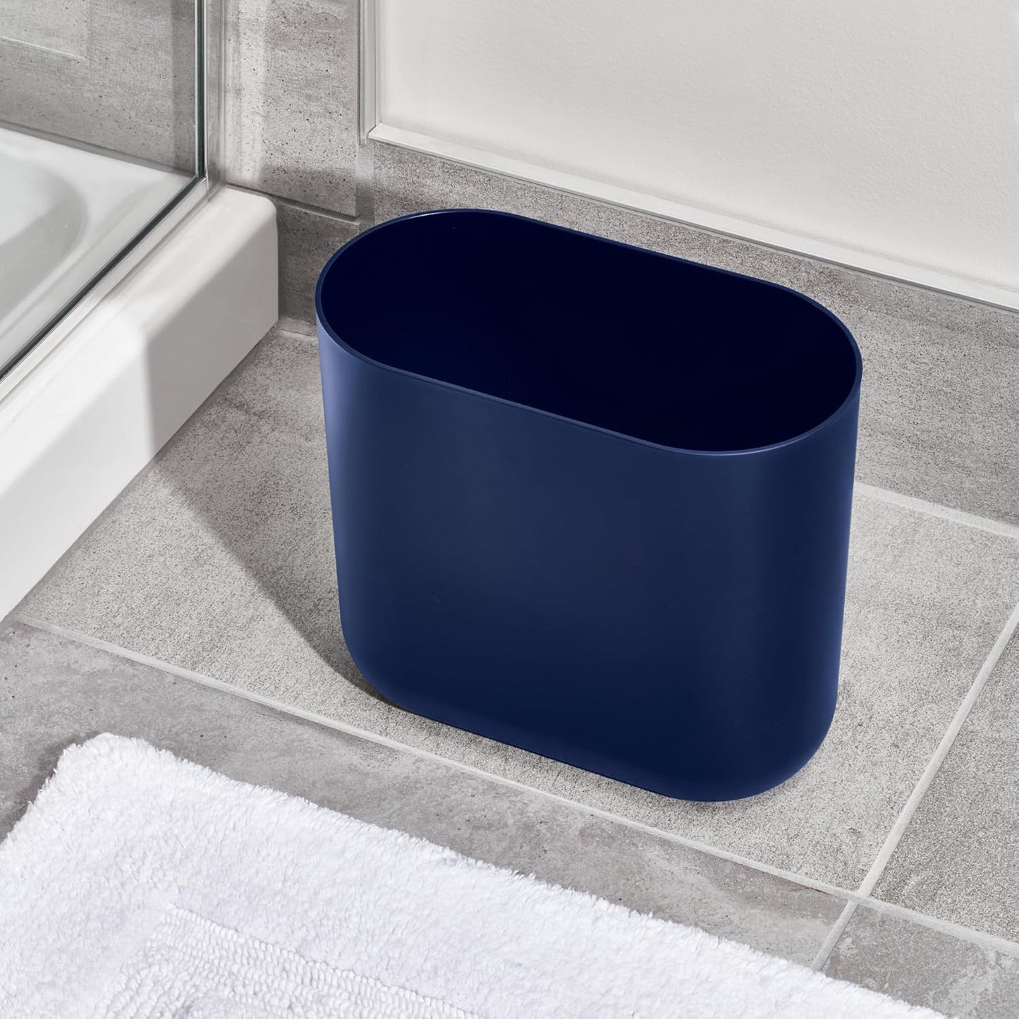 iDesign Small Oval Plastic Bathroom Trash Can - Ideal for Bathroom, Bedroom, or Office - Navy Blue